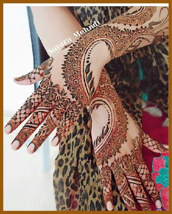 Stylish Back Hand Design With Looped Detailing Stylish Back Hand Mehndi Design